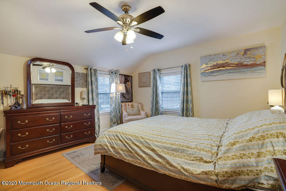 300 Spring Street Red Bank, NJ 07701 - Photo 17 of 25 a bedroom with a bed and a mirror on dresser