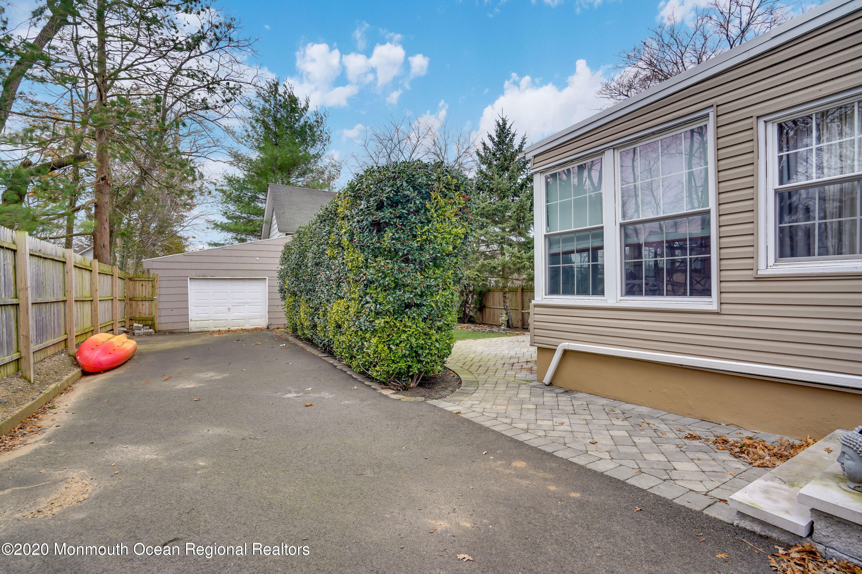 300 Spring Street Red Bank, NJ 07701 - Photo 21 of 25 a wooden bench sitting in front of a house