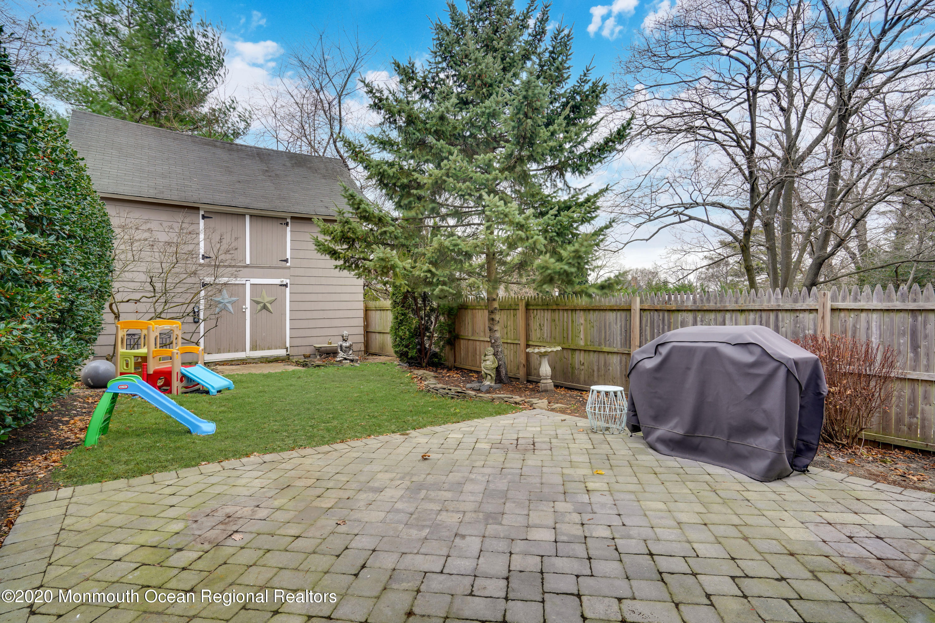 300 Spring Street Red Bank, NJ 07701 - Photo 23 of 25 a backyard of a house with trampoline and entertaining space