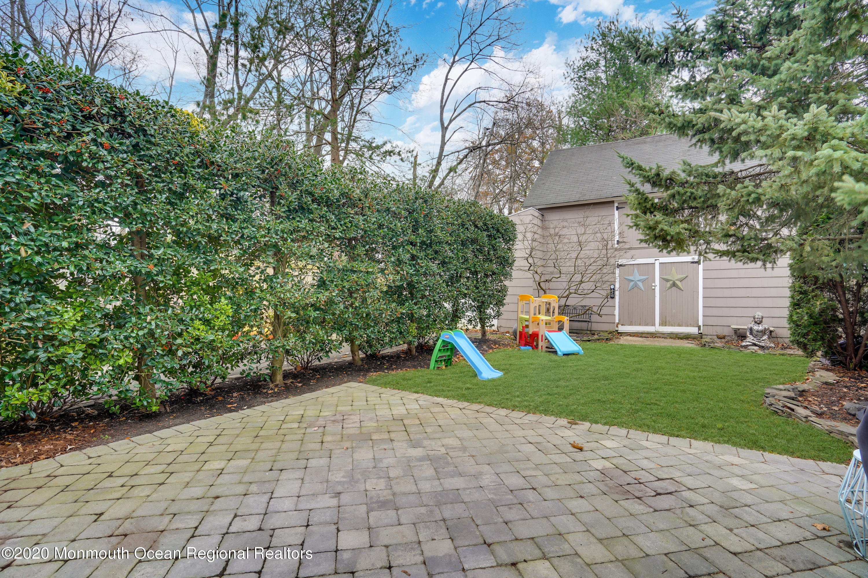 300 Spring Street Red Bank, NJ 07701 - Photo 24 of 25 a view of a yard with plants and a slide