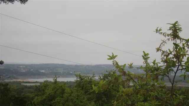 a view of a yard with a mountain