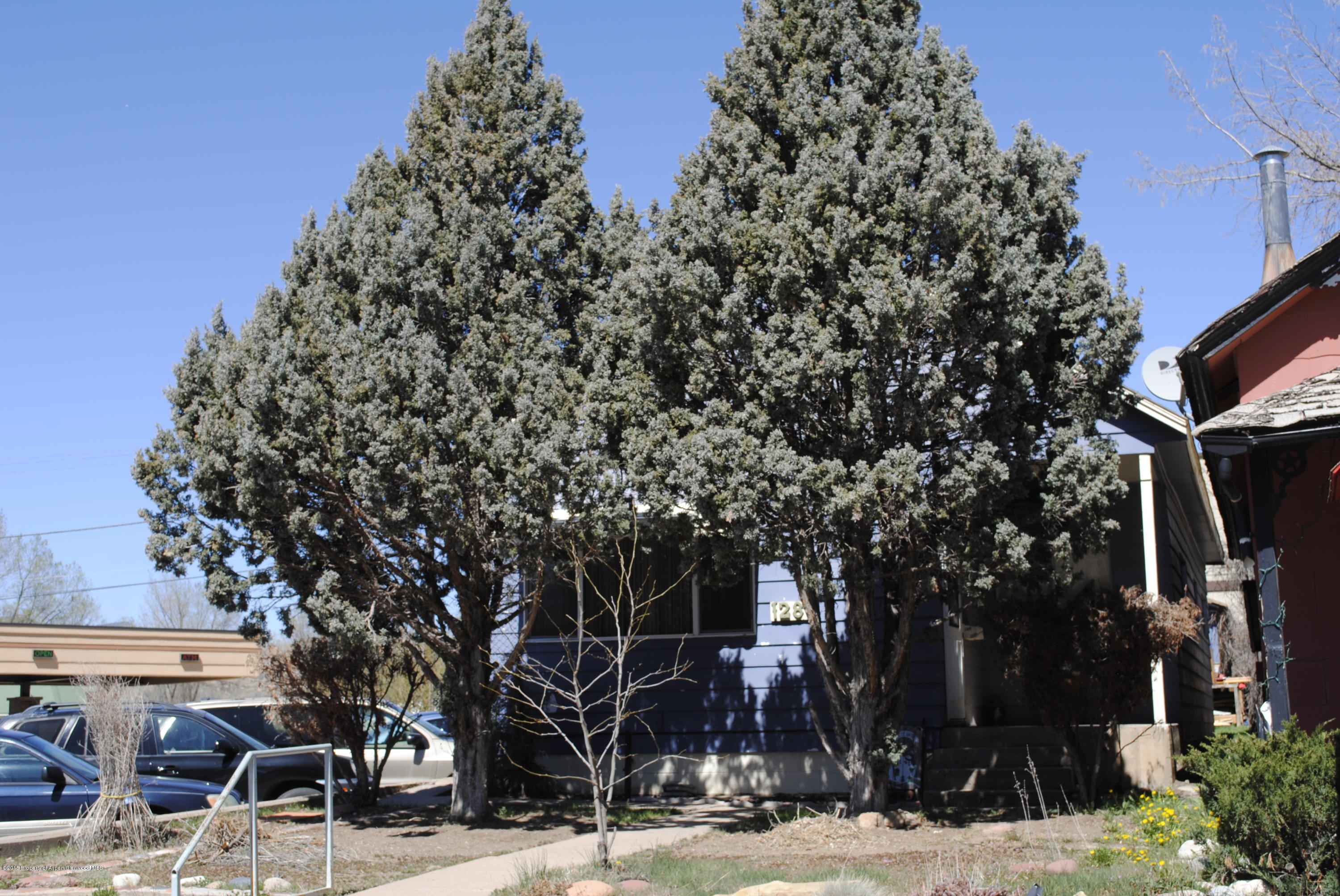 128 West 3rd Street Rifle, CO 81650 - Photo 1 of 16 a view of a building with a snow