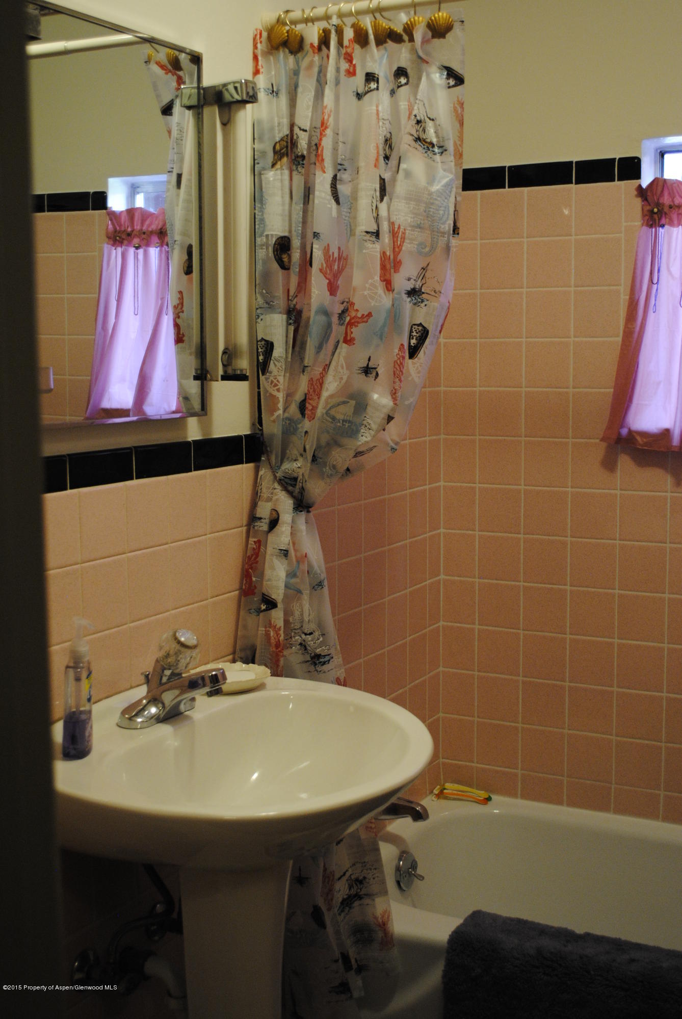 128 West 3rd Street Rifle, CO 81650 - Photo 5 of 16 a bathroom with a sink and a mirror