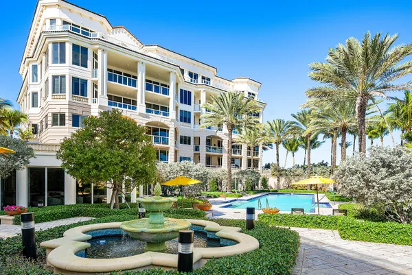 a view of yard with swimming pool and furniture