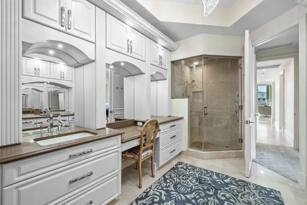 a bathroom with a sink a mirror and a shower