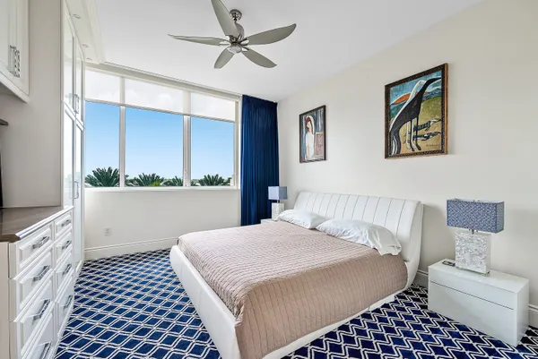 a bedroom with a bed and a view of bathroom