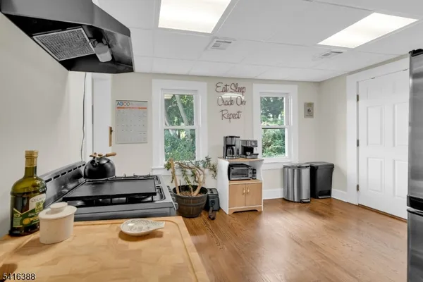 a kitchen with a stove a sink and a refrigerator
