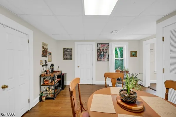 a living room with furniture and flowers
