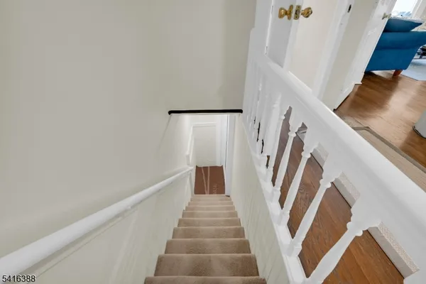 a view of staircase with white walls