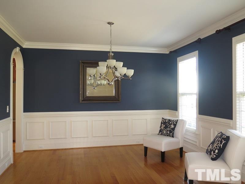 519 Chapanoke Road Raleigh, NC 27603 - Photo 3 of 25 a view of a livingroom with furniture wooden floor and a window