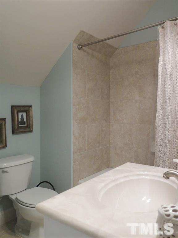 519 Chapanoke Road Raleigh, NC 27603 - Photo 22 of 25 a bathroom with a bathtub and a toilet