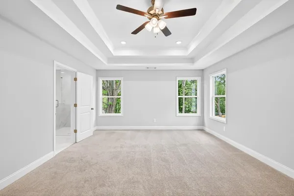 a view of a kitchen with a sink and dishwasher a refrigerator with wooden floor