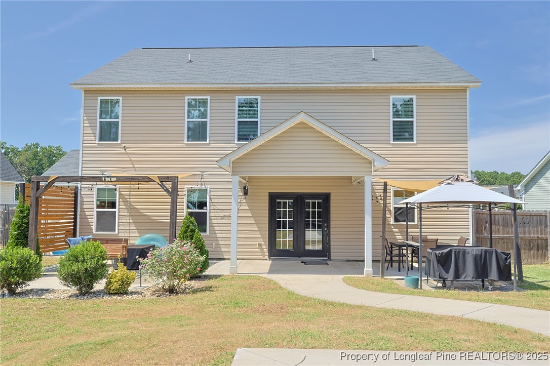 213 Sand Rock Road Fayetteville, NC 28306 - Photo 12 of 27 a front view of a house with a yard