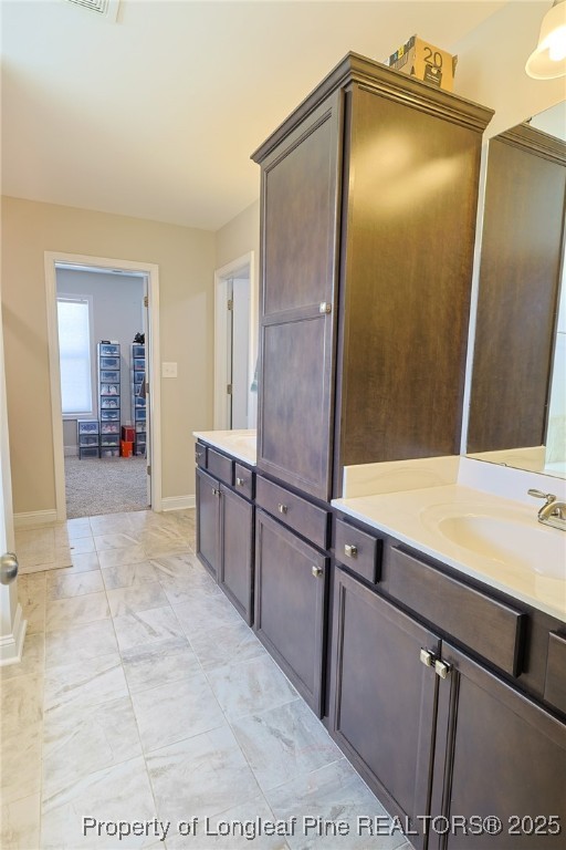 213 Sand Rock Road Fayetteville, NC 28306 - Photo 17 of 27 a bathroom with a sink and a mirror
