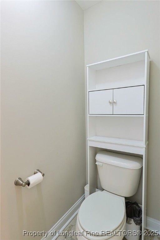 213 Sand Rock Road Fayetteville, NC 28306 - Photo 20 of 27 a white toilet sitting next to a shower