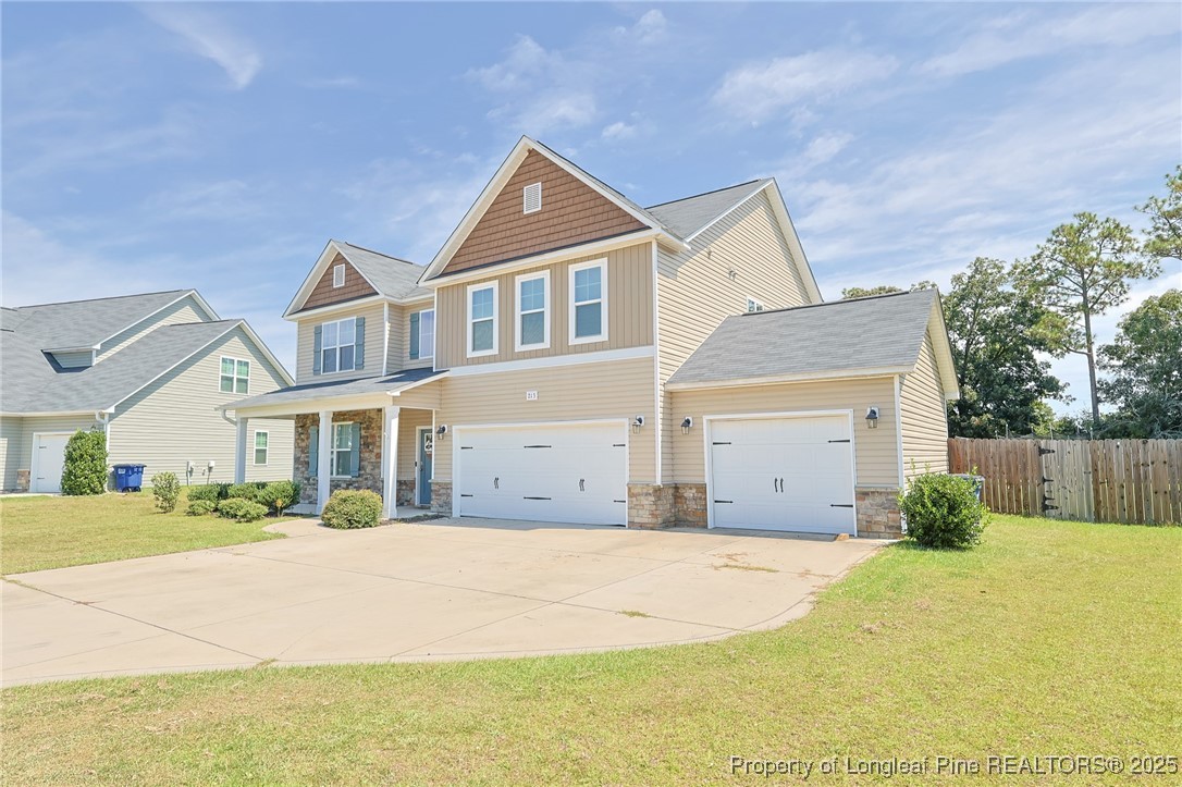 213 Sand Rock Road Fayetteville, NC 28306 - Photo 27 of 27 a front view of a house with a yard