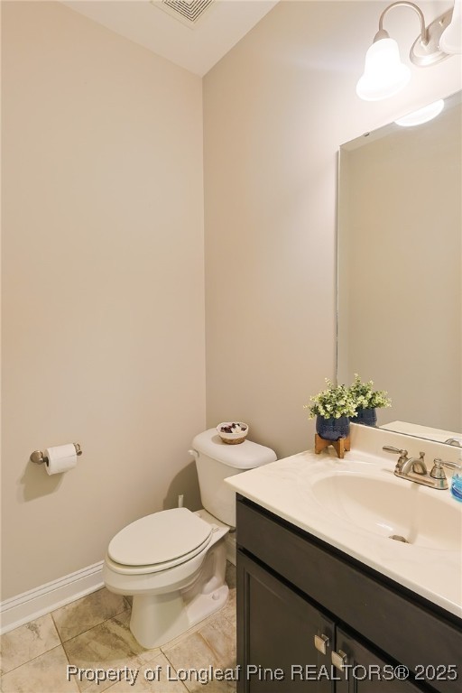 213 Sand Rock Road Fayetteville, NC 28306 - Photo 4 of 27 a bathroom with a sink a toilet and mirror