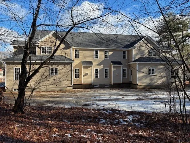 a view of a large house with a yard