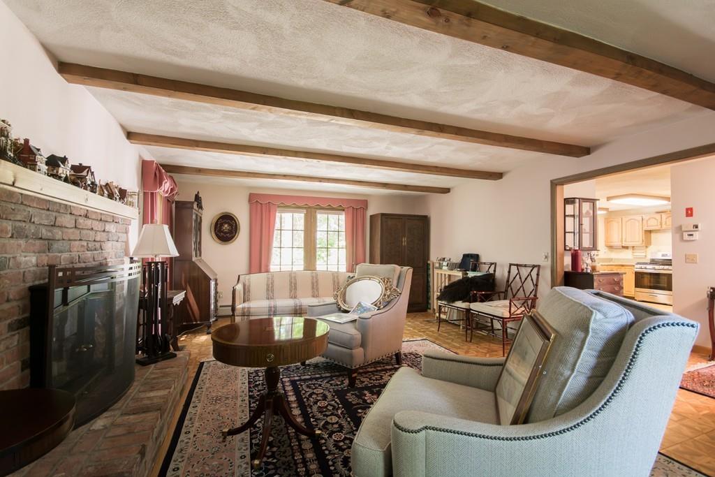 1 Bells Brook Road Lakeville, MA 02347 - Photo 3 of 21 a living room with fireplace furniture and a floor to ceiling window