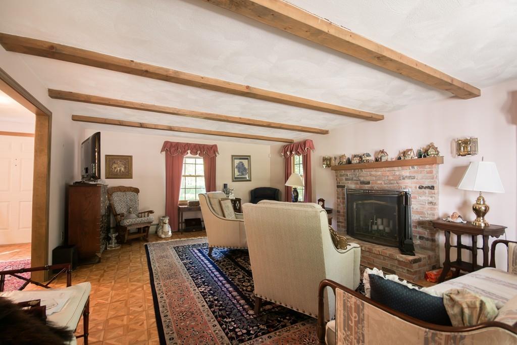1 Bells Brook Road Lakeville, MA 02347 - Photo 4 of 21 a living room with furniture and a fireplace