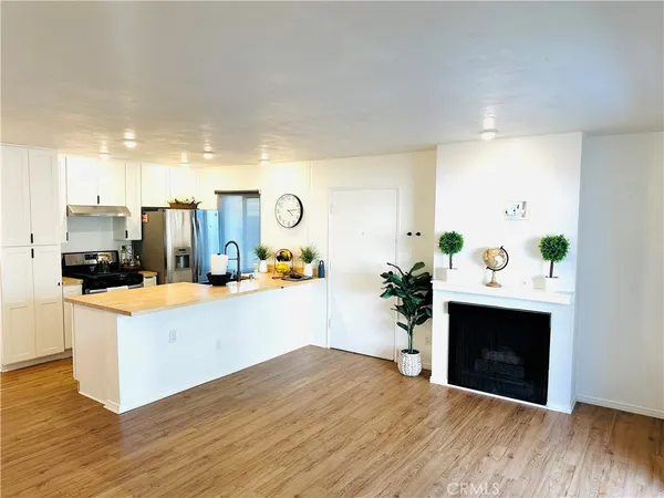 a view of a kitchen with microwave and cabinets