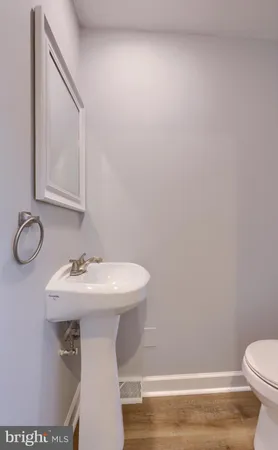 a bathroom with a sink toilet and vanity