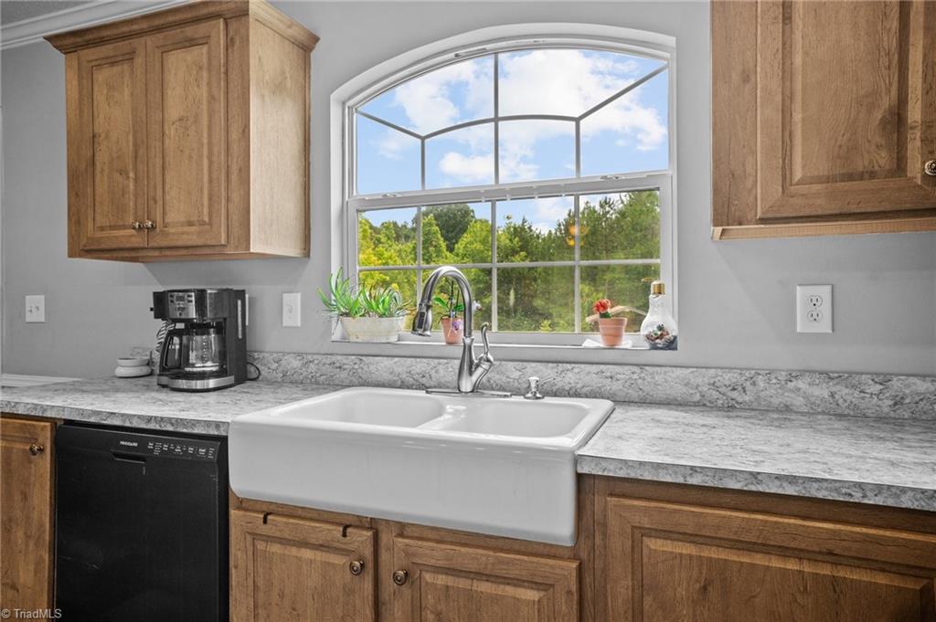 1792 Hill Road Lexington, NC 27292 - Photo 15 of 48 View of kitchen with large double sink and cabinetry.