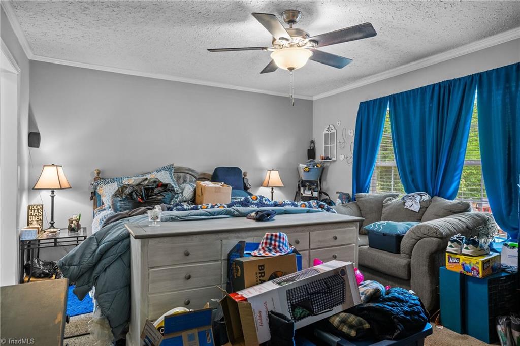 1792 Hill Road Lexington, NC 27292 - Photo 16 of 48 Huge primary bedroom with ceiling fan.