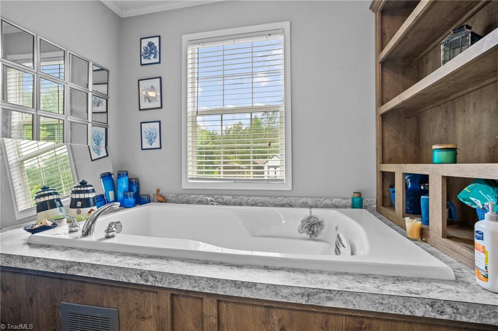 1792 Hill Road Lexington, NC 27292 - Photo 18 of 48 Garden tub in the primary bathroom.