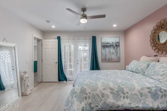 a bathroom with double vanity sink and a mirror