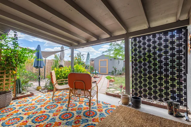 a view of a house with patio and a yard