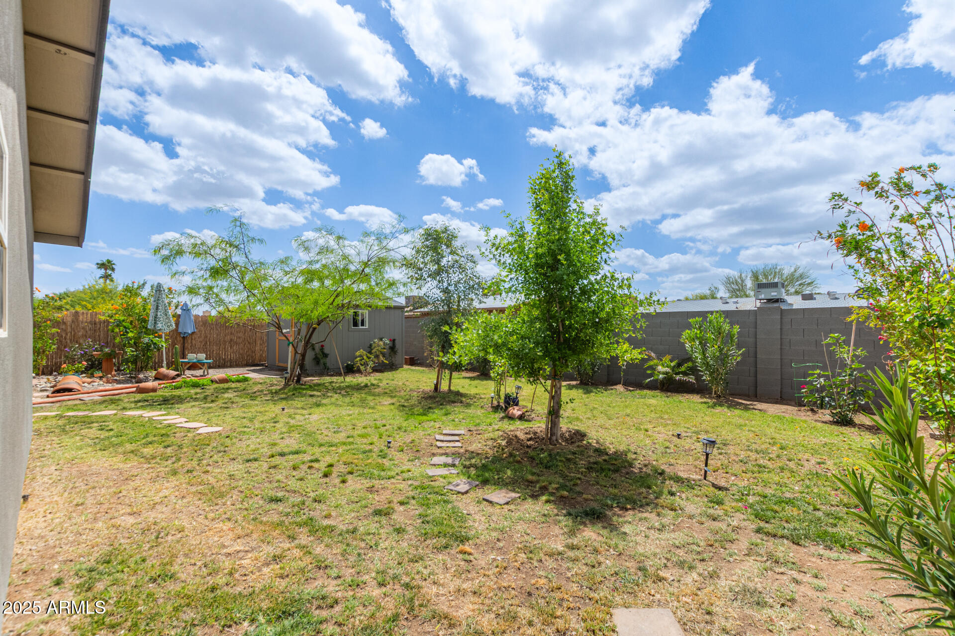 313 West Utopia Road Phoenix, AZ 85027 - Photo 27 of 59 a backyard of a house with a yard and outdoor seating