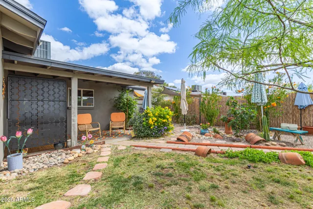 a view of a house with outdoor space and sitting area