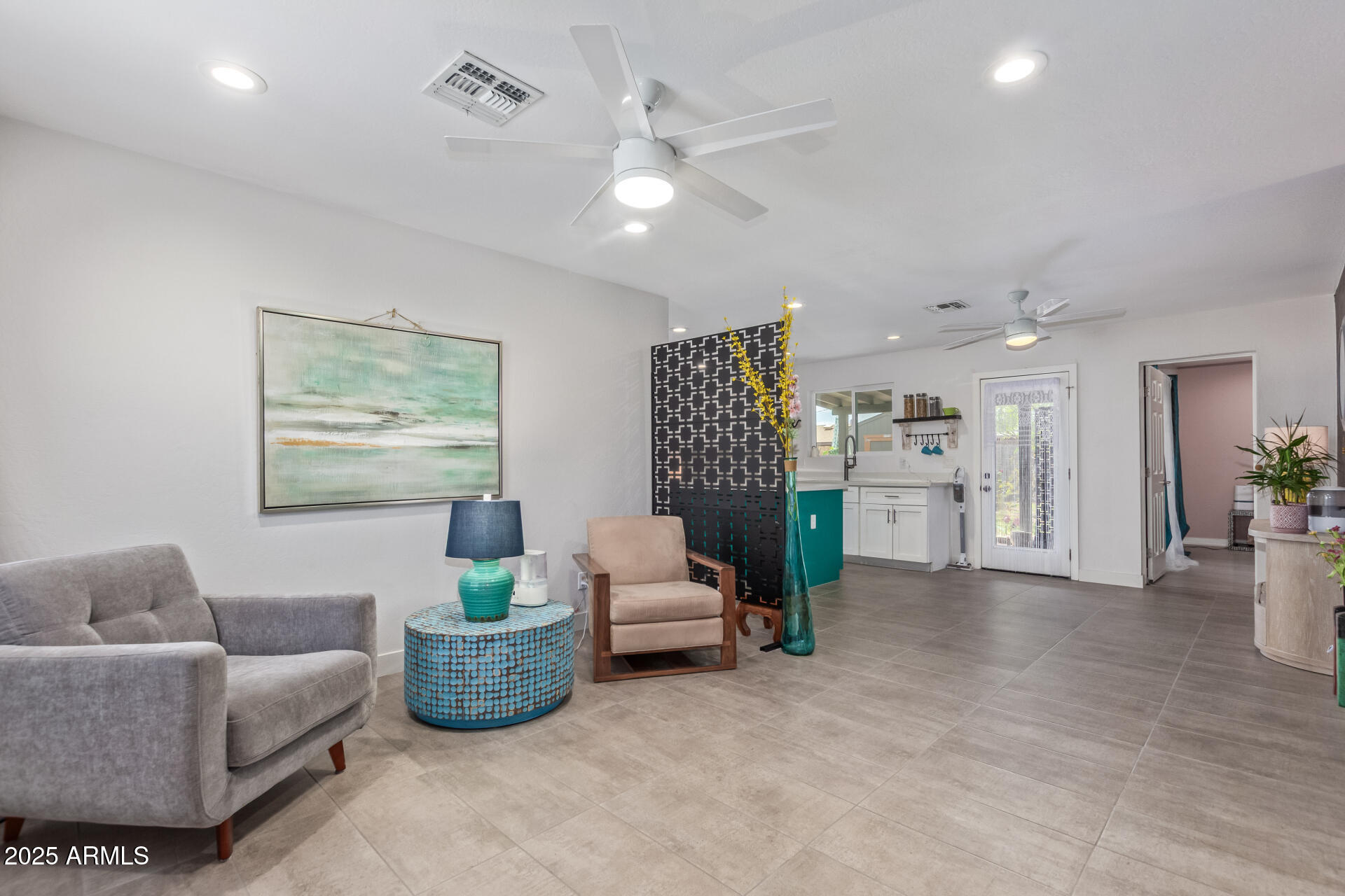 313 West Utopia Road Phoenix, AZ 85027 - Photo 3 of 59 a living room with furniture and a chandelier