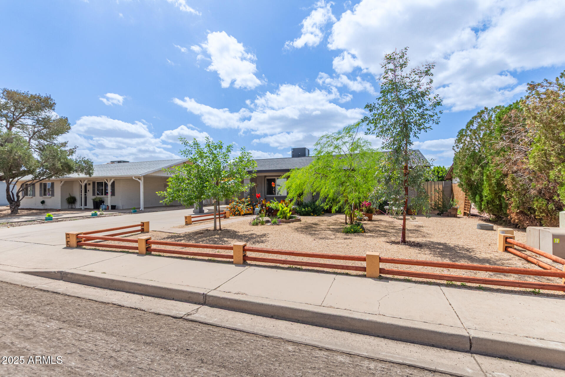 313 West Utopia Road Phoenix, AZ 85027 - Photo 32 of 59 a view of a house with outdoor space and sitting area