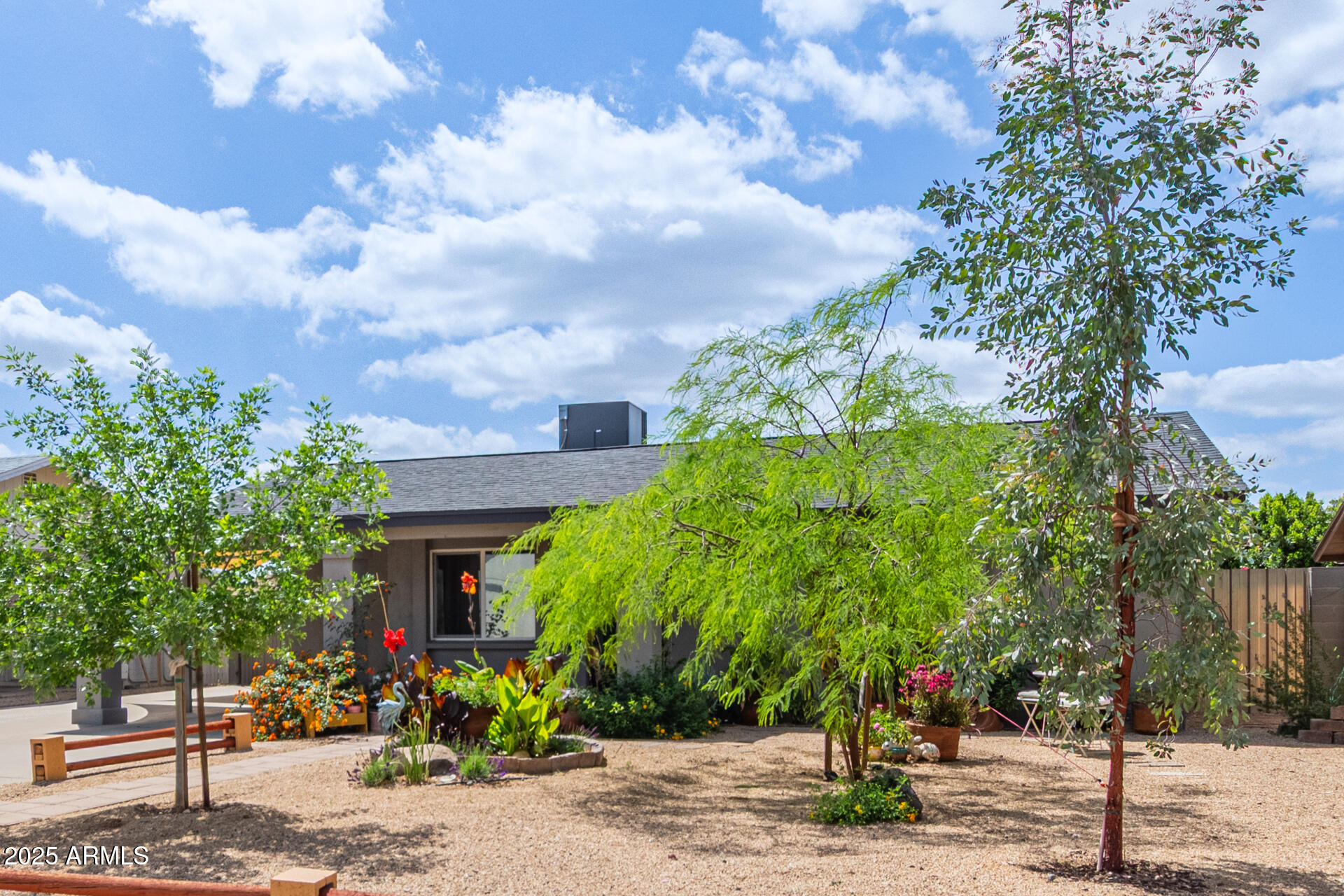 313 West Utopia Road Phoenix, AZ 85027 - Photo 33 of 59 a front view of a house with a tree