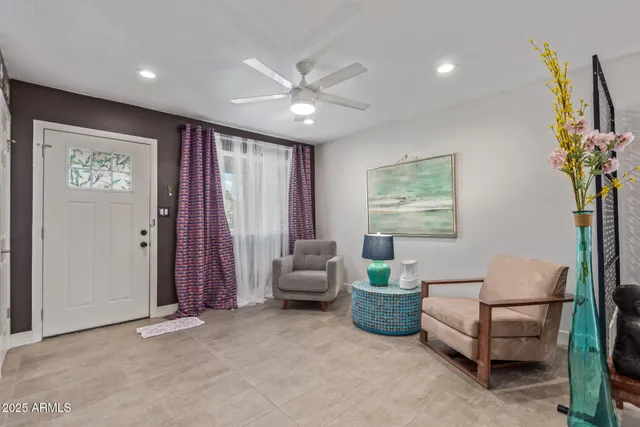 a living room with furniture and a window