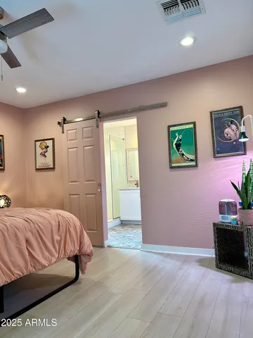 a kitchen with kitchen island granite countertop stainless steel appliances cabinets a sink and a counter top space