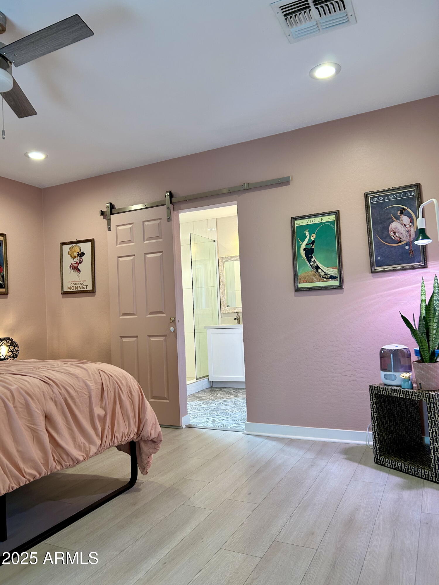 313 West Utopia Road Phoenix, AZ 85027 - Photo 41 of 59 a bedroom with a bed and a couch