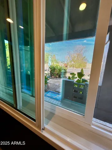 a living room with furniture and potted plant