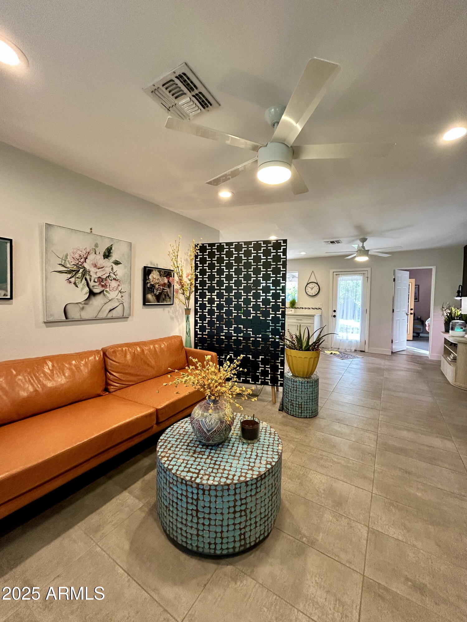 313 West Utopia Road Phoenix, AZ 85027 - Photo 52 of 59 a living room with furniture a rug and a chandelier