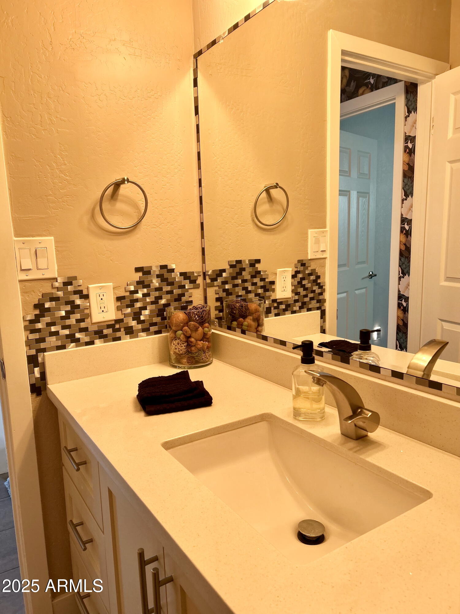 313 West Utopia Road Phoenix, AZ 85027 - Photo 59 of 59 a bathroom with a sink and a mirror