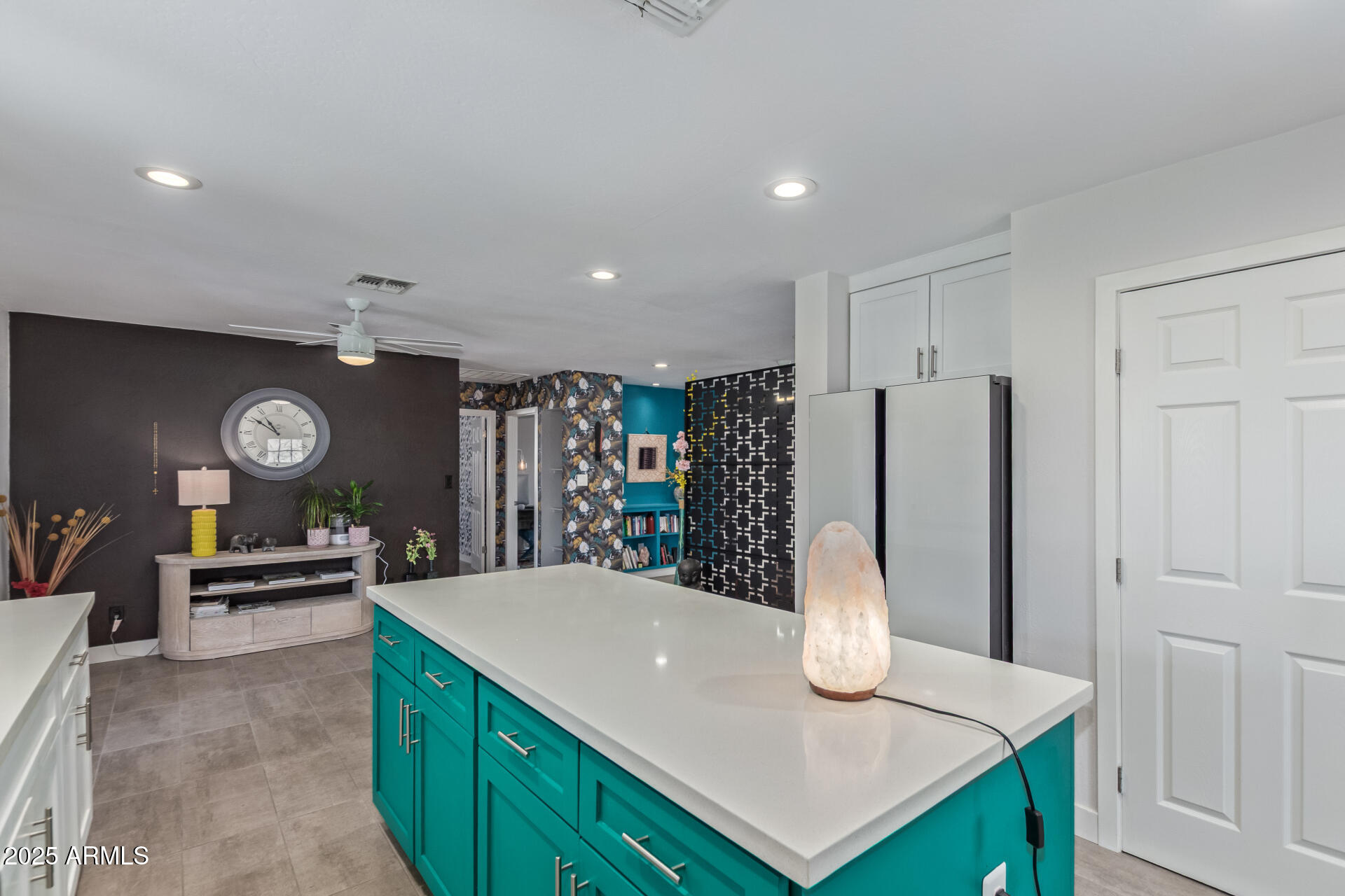 313 West Utopia Road Phoenix, AZ 85027 - Photo 9 of 59 a kitchen with stainless steel appliances kitchen island a refrigerator and a stove top oven