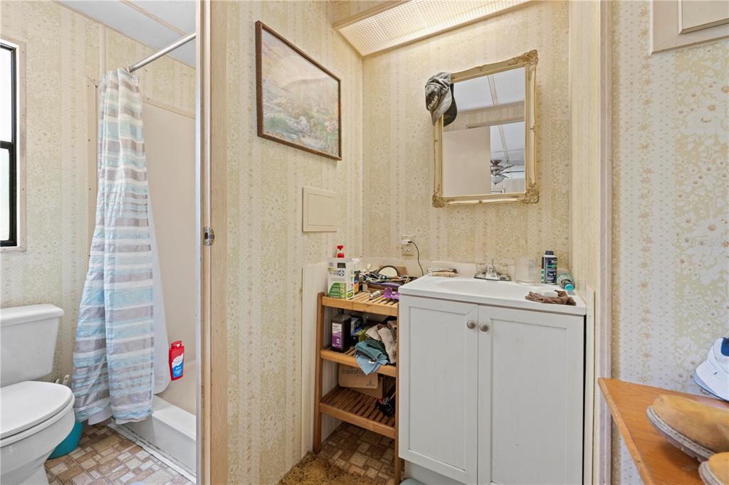 7373 Fall Street Brooksville, FL 34613 - Photo 14 of 26 a bathroom with a sink toilet and shower