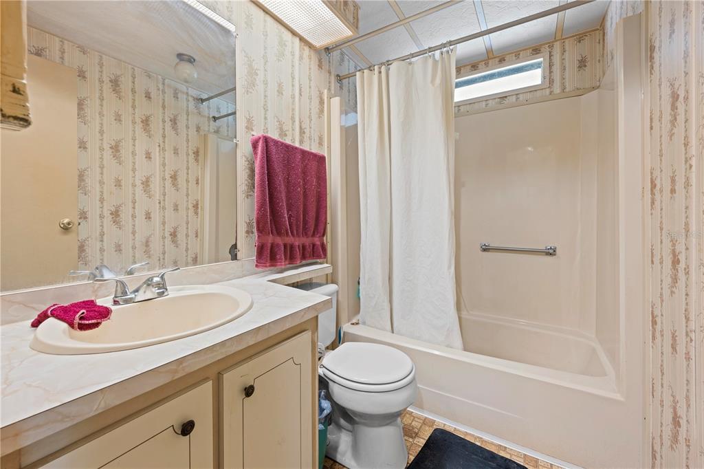 7373 Fall Street Brooksville, FL 34613 - Photo 16 of 26 a bathroom with a sink toilet and shower