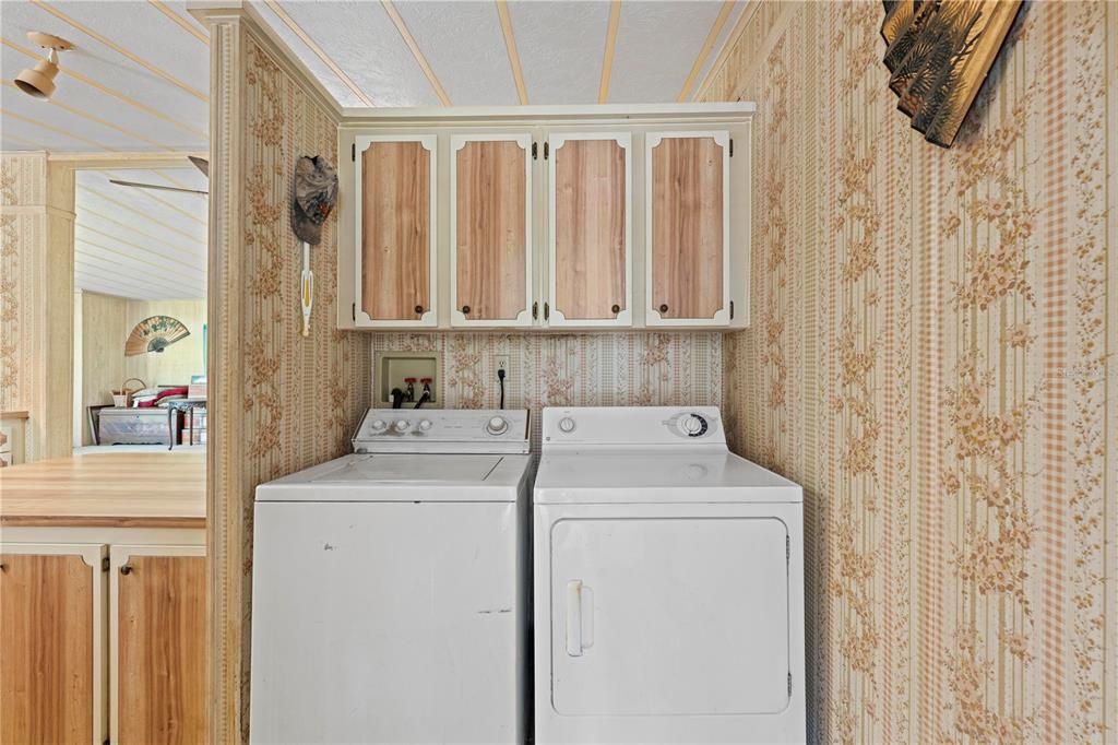 7373 Fall Street Brooksville, FL 34613 - Photo 17 of 26 a view of a utility room with dryer and washer