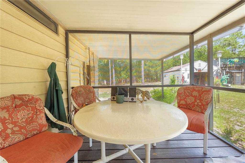 7373 Fall Street Brooksville, FL 34613 - Photo 18 of 26 a view of a dining room with furniture window and outside view