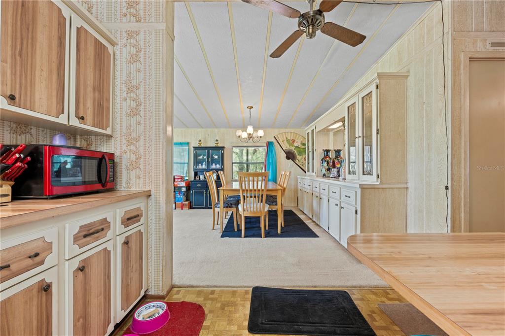 7373 Fall Street Brooksville, FL 34613 - Photo 3 of 26 a living room with furniture and a fireplace