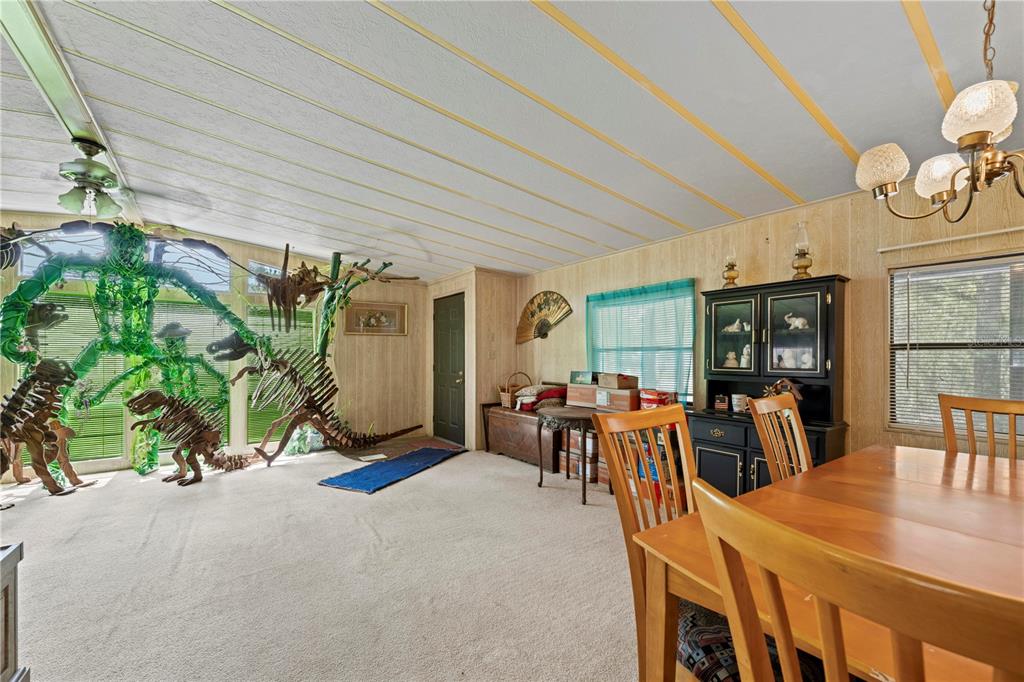 7373 Fall Street Brooksville, FL 34613 - Photo 6 of 26 a view of a dining room with furniture window and outdoor kitchen