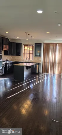 a view of kitchen with stove and microwave